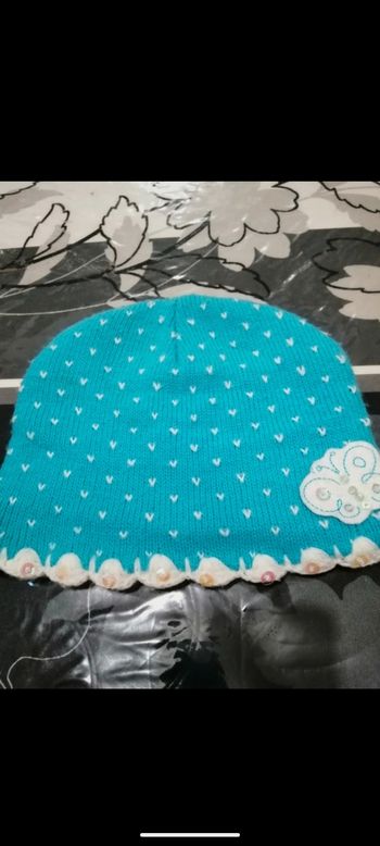 Bonnet bleu turquoise et blanc. Taille 4/5 ans