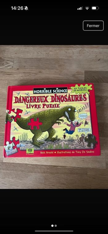 Livre puzzle Dangereux dinosaures