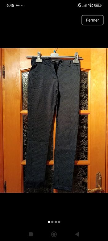 Pantalon stretch noir à pois blancs 