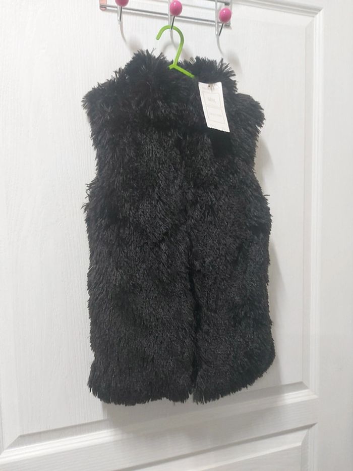 Gilet sans manche neuf avec étiquette 10 ans