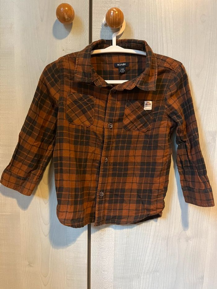 Chemise à carreaux marron et noir