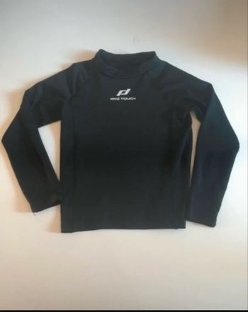 Sous pull thermique de sport garçon très bon état taille 7 ans couleur noir