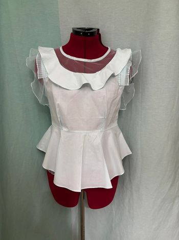 Blouse forme peplum à volants bleu clair