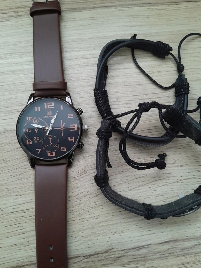Montre homme noire et argentée, bracelet marron, montre a quartz - photo numéro 2