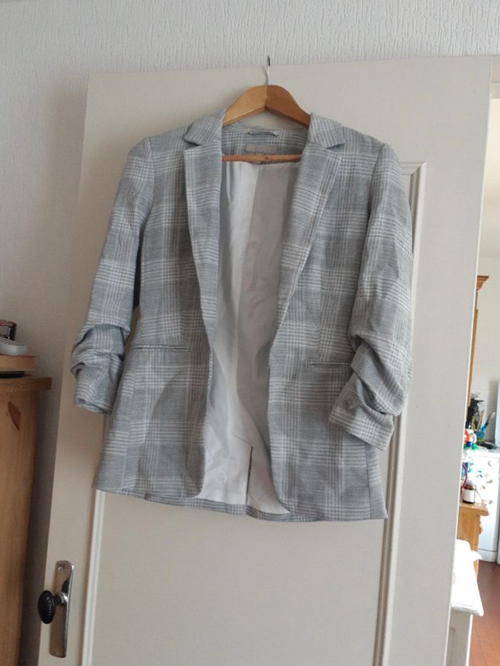 Veste à carreaux H et M