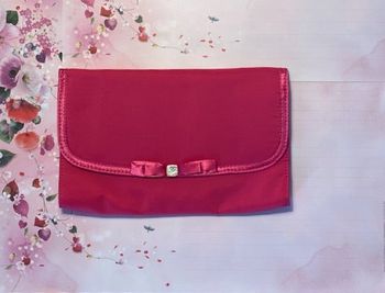 Lancôme – Mignonne pochette rose satinée