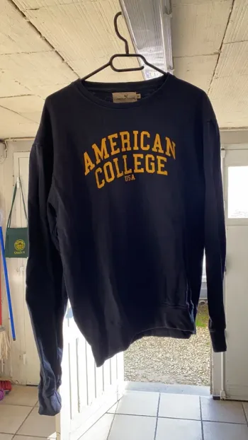 Pull American College bleu T M