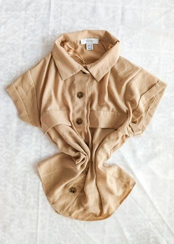 Blouse beige à boutons