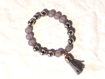 Bracelet Extensible Perles Mauves Dorées Facettes Pompon Allongé Bijou Doré Fantaisie Femmes