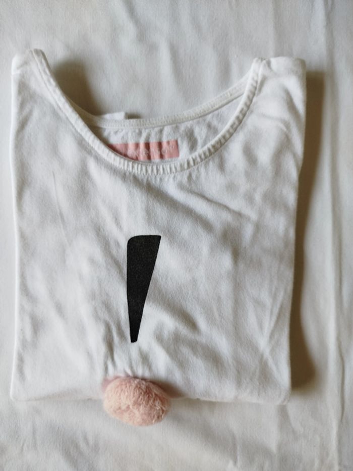 haut blanc avec pompon 8ans