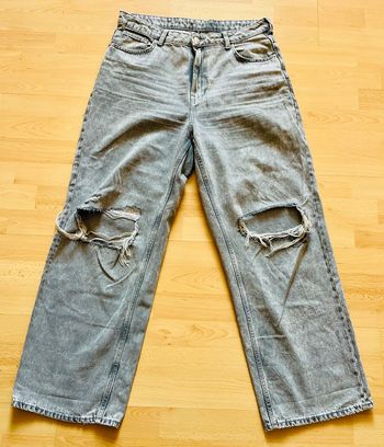Jean jambes larges troués gris