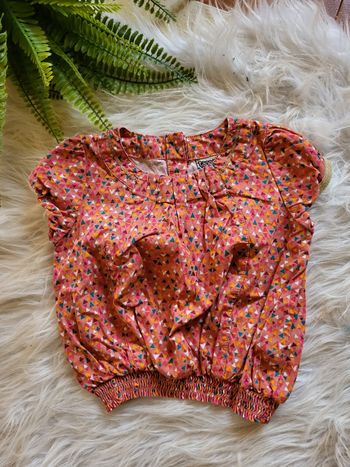 Blouse sans manche tape à l'œil