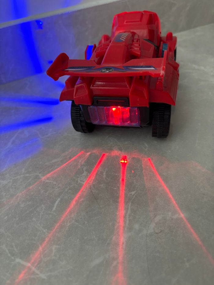 Jouet dinosaure /voiture qui se transforme avec sons et lumière avance seule rouge - photo numéro 5