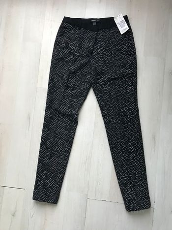 Pantalon slim noir à pois brillants Mango