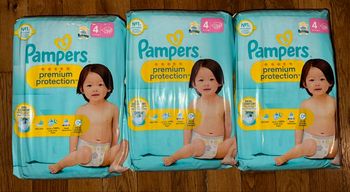 3 paquets de couches Pampers taille 4