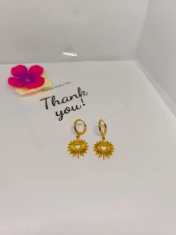 Boucles d'oreilles dorées cœur et soleil