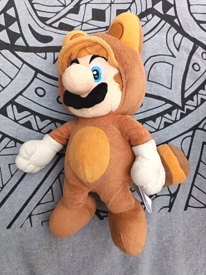 Peluche Mario version panda roux