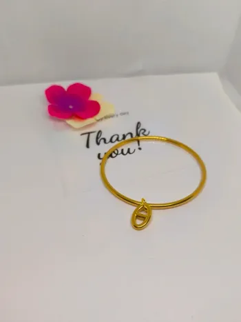 Bracelet jonc doré avec breloque maille marine