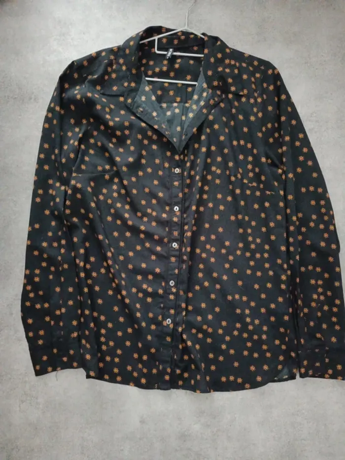 Chemise manches longues noir et oeil orange Desires M