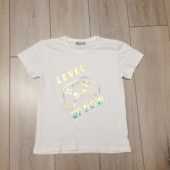 Tres jolie maillot avec écriture. Garçon 12 ans. Marque Npo