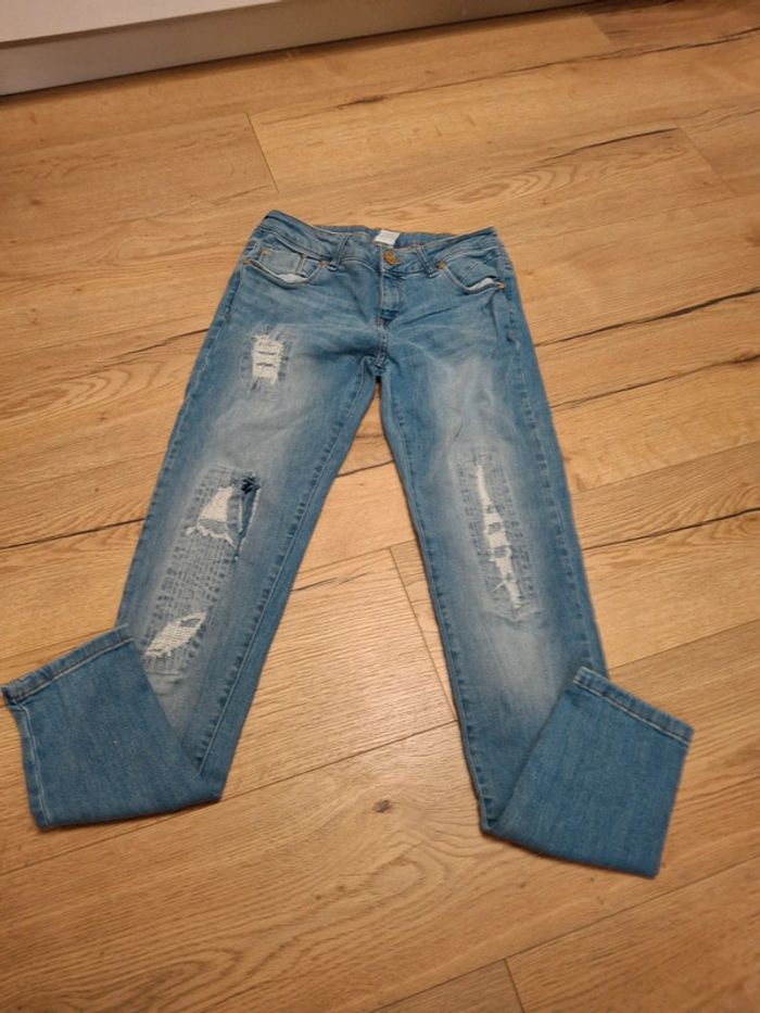 Jean troué bleu clair femme / fille taille 16 ans ( 176 )