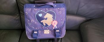 Cartable cheval à roulette