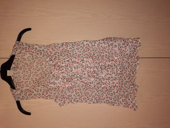 Blouse motifs noirs et oranges taille S