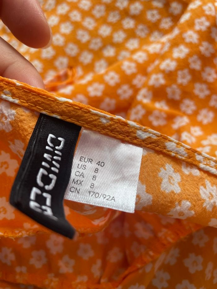 Robe légère orange à fleurs blanche H&M taille 40 parfait état - photo numéro 2