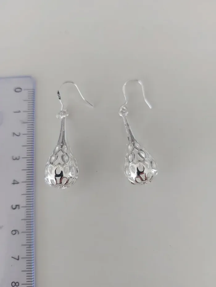Boucles d'oreilles ajourées en argent - photo numéro 2