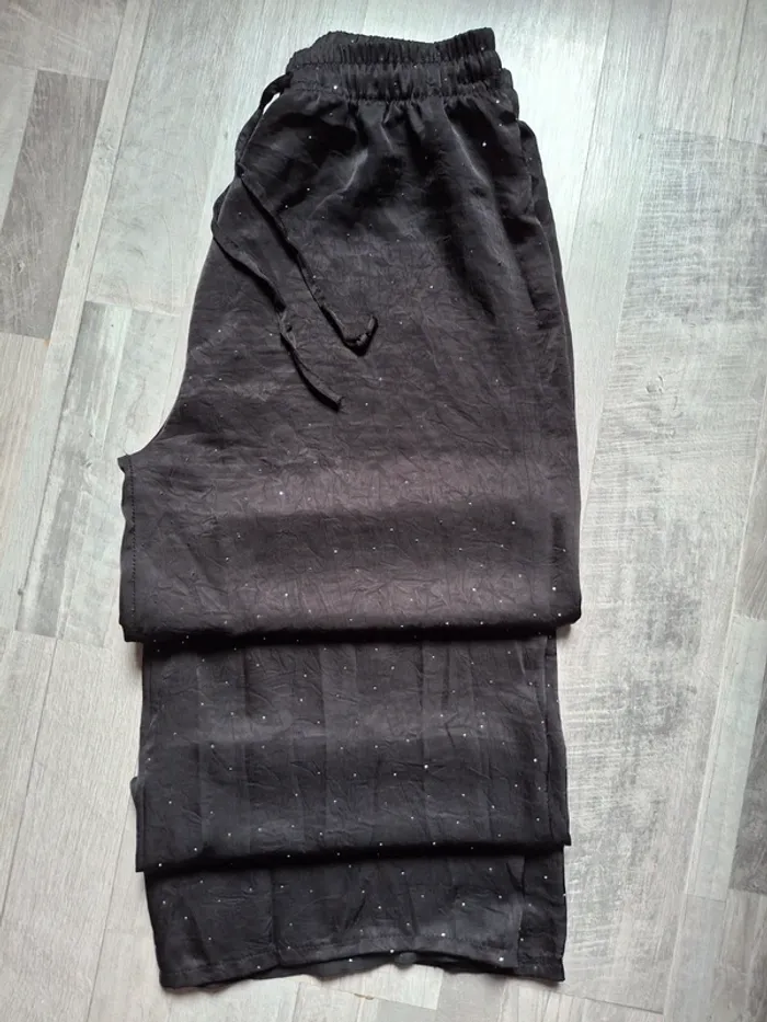 Pantalon palazzo noire avec strass