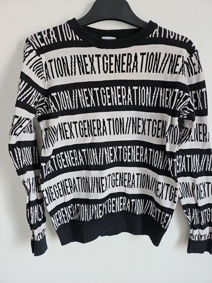 Pull 👦 noir et blanc 10 ans - photo numéro 2
