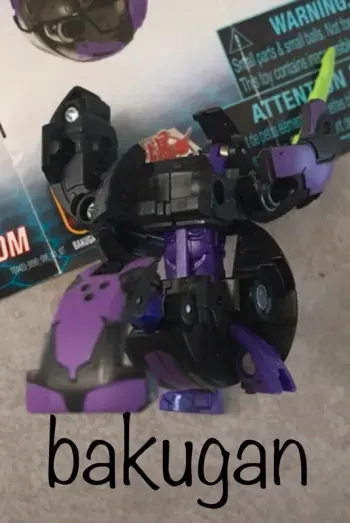 jouet bakugan darkus cyndeous noir et violet avec notice de remontage