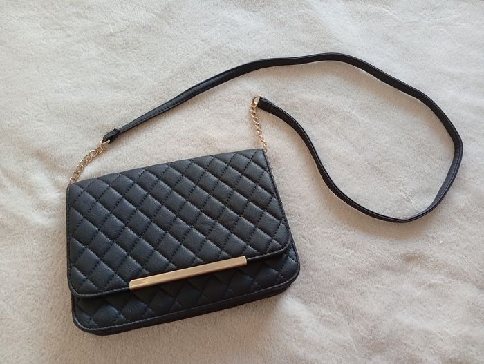 Sac bandoulière noir et doré. Atmosphère - photo numéro 1