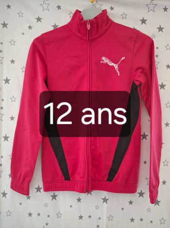 Veste zippée rose et noir col montant 12 ans Puma
2 poches devant et 2 intérieur 
Très bon état ni trous ni tache