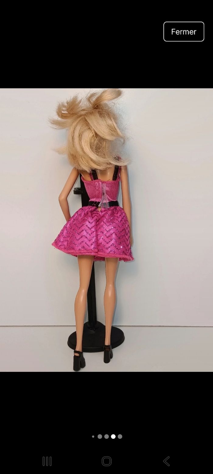 Poupée mattel barbie tenue fushia et noir tête 1998 corp 2013 
Poupée et ensemble compris - photo numéro 6