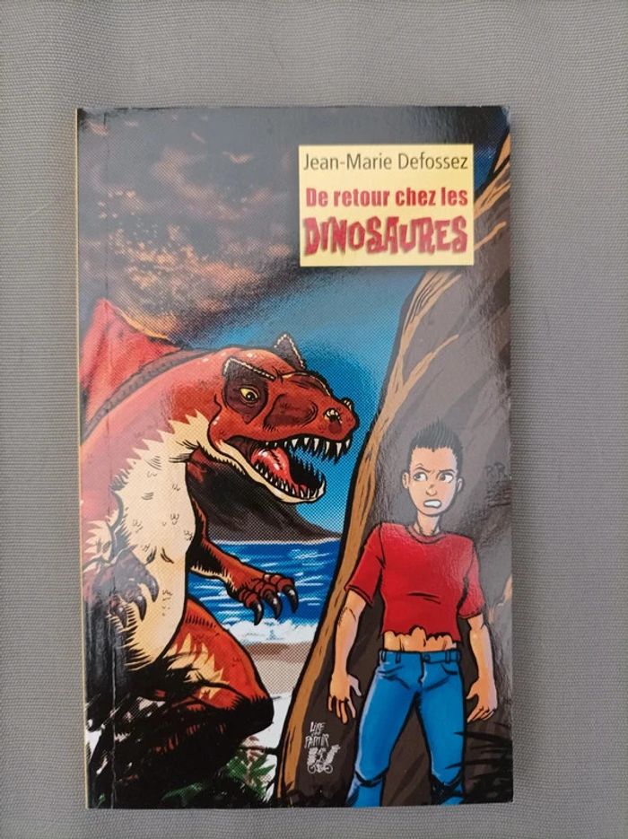 Livre "de retour chez les dinosaures" neuf