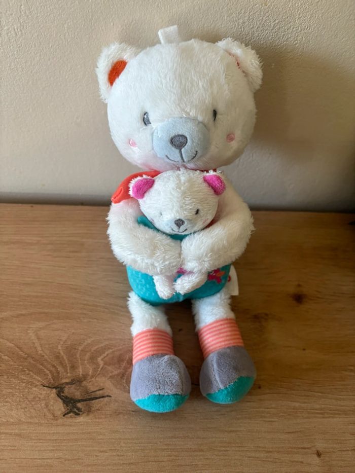 Doudou ours avec son bébé bleu orange musical ouatoo
