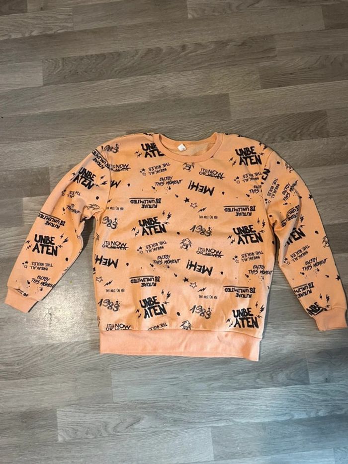 Jolie pull fin couleur orange taille 9 / 10 ans