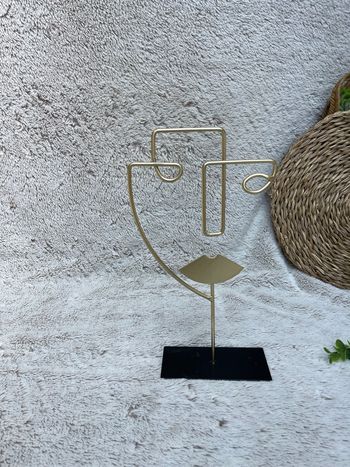 Statue en fil doré visage - CASA
