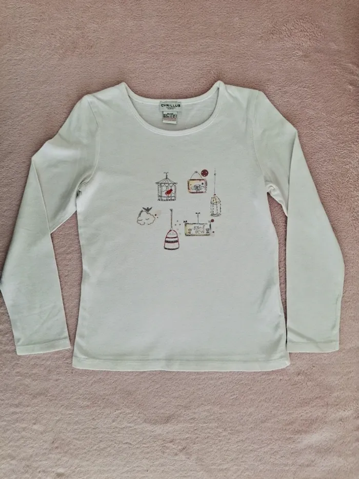 T-shirt manches longues Cyrillus 8 ans blanc motifs cages à oiseaux chat jaunes et oranges
