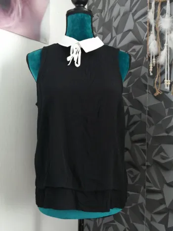 Blouse noire  sans manches doublée à col blanc avec lien à nouer / gémo / (M)