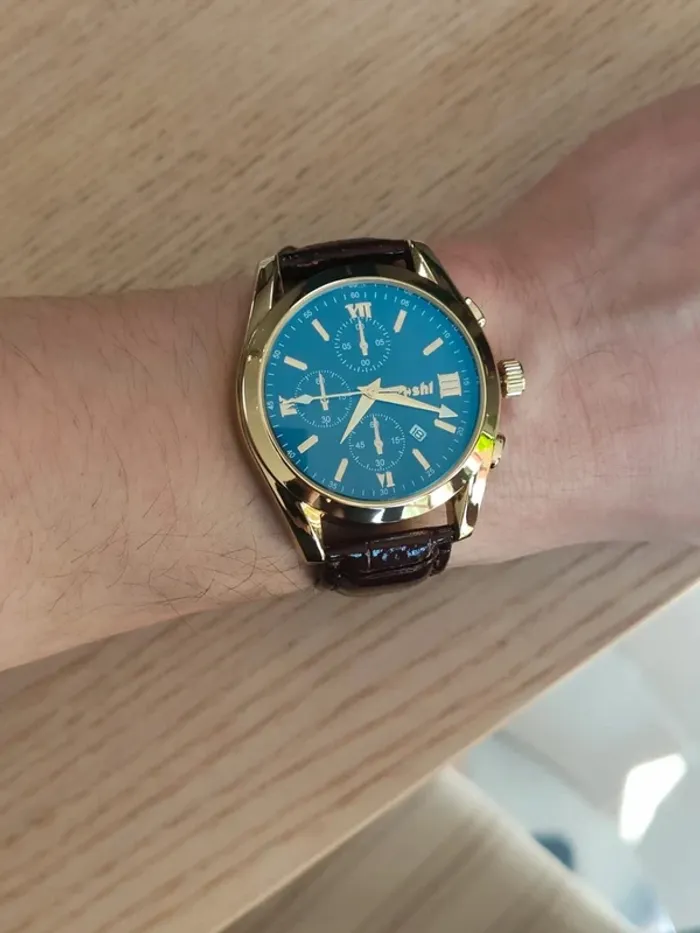 Montre marron, dorée, arrondie à reflets bleus - photo numéro 3