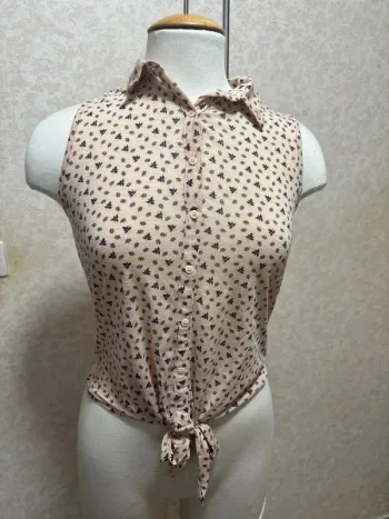 Chemise sans manche taille 34-36 marque kiabi