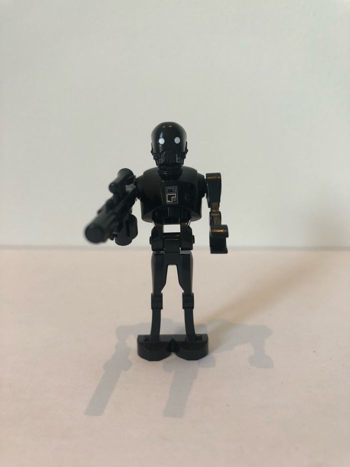 Figurine type lego droïde K-2SO. Star Wars