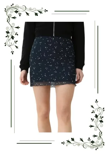 Jupe courte noire à motifs étoiles blanches Pimkie taille L
