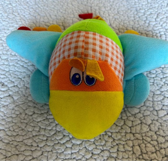 Avion multicolore à roulettes