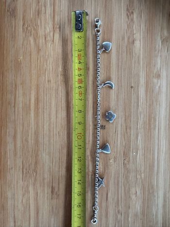 Bracelet Mauboussin 5 charms dont 1 à faire remonter