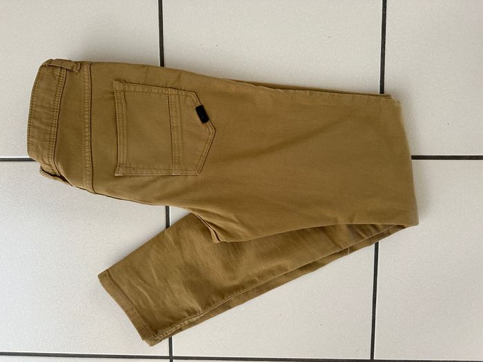 Jeans moutarde taille 14 ans en très bon état - photo numéro 1