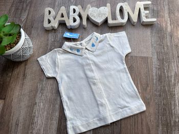 - polo Canari baby    - 6 mois - Neuf avec étiquette 