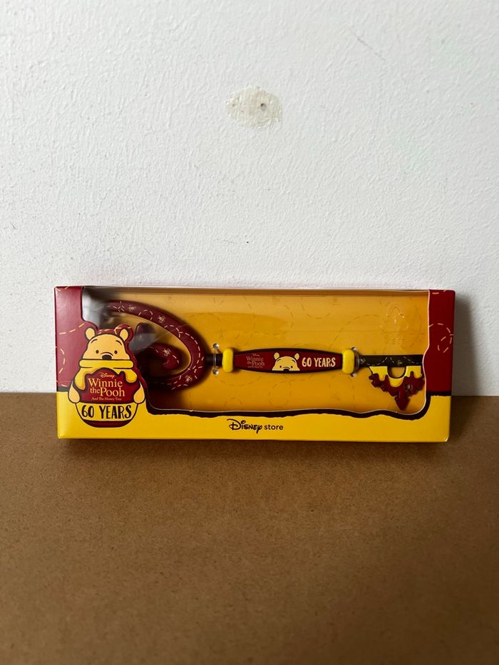 Clé 60e Anniversaire de Winnie l’Ourson et l’Arbre à Miel